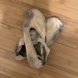 Thoroughly worn pink canvas ballet flats for crafts